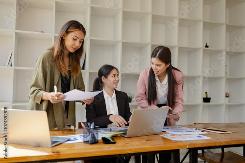 Technology and financial advisory services concept. Businesswoman teamwork and working on digital laptop computer with advisor showing plan of investment to clients at table office. Digital marketing.