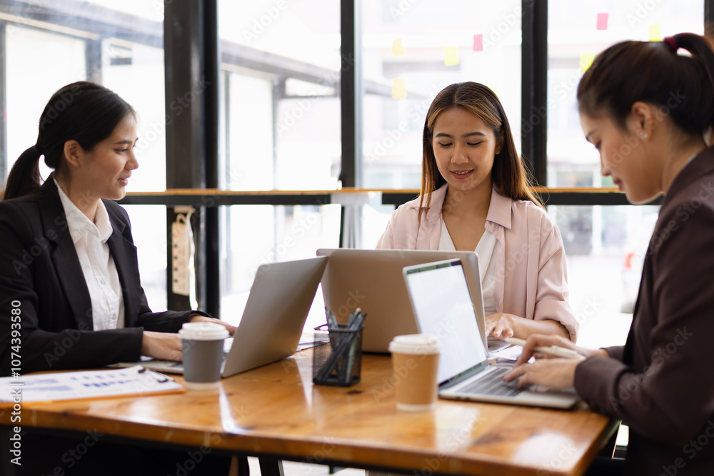 Technology and financial advisory services concept. Businesswoman teamwork and working on digital laptop computer with advisor showing plan of investment to clients at table office. Digital marketing. Technology and financial advisory services concept. Businesswoman teamwork and working on digital laptop computer with advisor showing plan of investment to clients at table office. Digital marketing.
