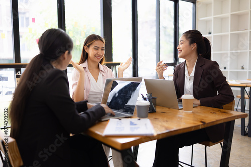 Technology and financial advisory services concept. Businesswoman teamwork and working on digital laptop computer with advisor showing plan of investment to clients at table office. Digital marketing.