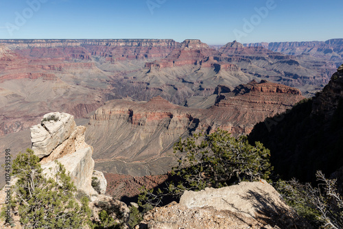 Midday views at some spectacular geological formations, red, pink, orange colorful cliffs and rocks from South Rim at Grand Canyon National Park, Arizona. High quality picture for download. photo