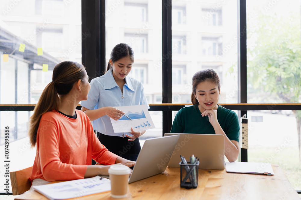 group of asian businesswoman working on laptop with finances analysis report at desk in office, business financing, accounting banking, Team of creative and business planning, group of asian businesswoman working on laptop with finances analysis report at desk in office, business financing, accounting banking, Team of creative and business planning,