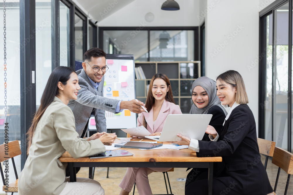 Obraz premium Team of Asian business people and working together in office, Startup projects and business presentation at meeting room.