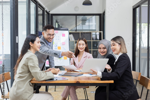 Team of Asian business people and working together in office, Startup projects and business presentation at meeting room.