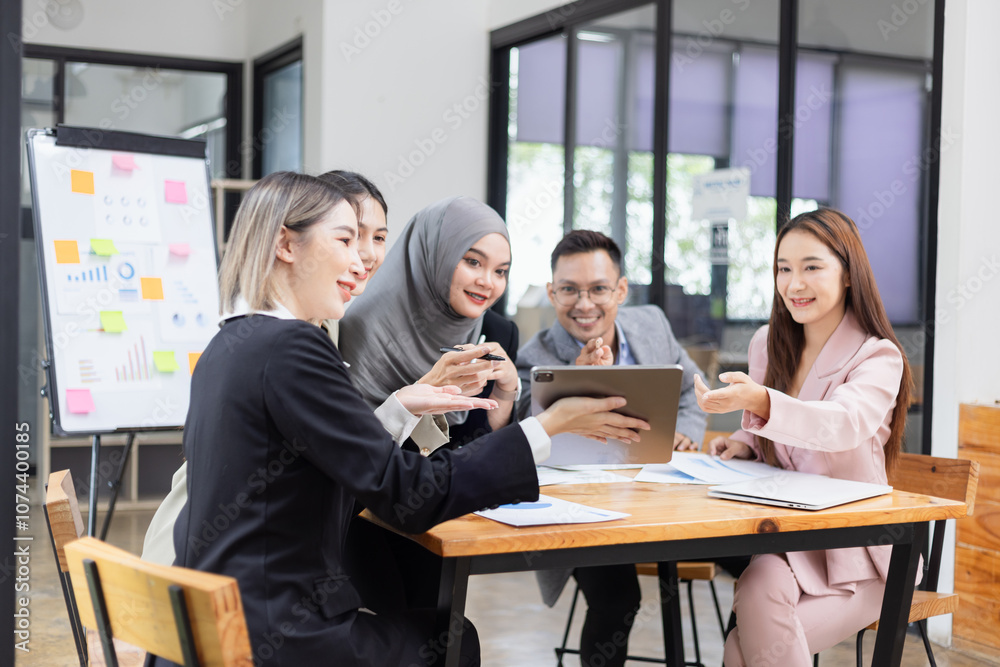 Team of Asian business people and working together in office, Startup projects and business presentation at meeting room. Team of Asian business people and working together in office, Startup projects and business presentation at meeting room.
