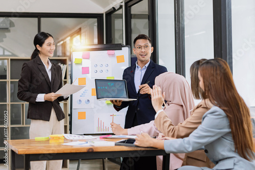 Team of Asian business people and working together in office, Startup projects and business presentation at meeting room.