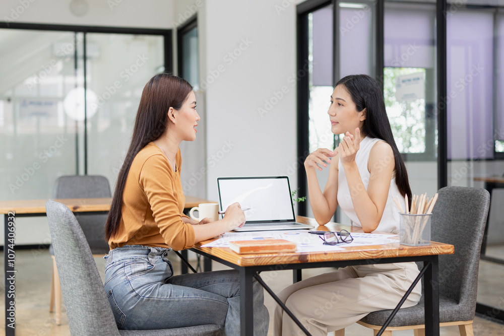 Asian businesswoman working on laptop with finances analysis report at desk in office, business financing, accounting banking, Asian businesswoman working on laptop with finances analysis report at desk in office, business financing, accounting banking,