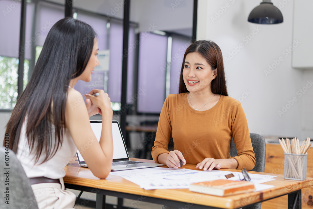 Asian businesswoman working on laptop with finances analysis report at desk in office, business financing, accounting banking, Asian businesswoman working on laptop with finances analysis report at desk in office, business financing, accounting banking,