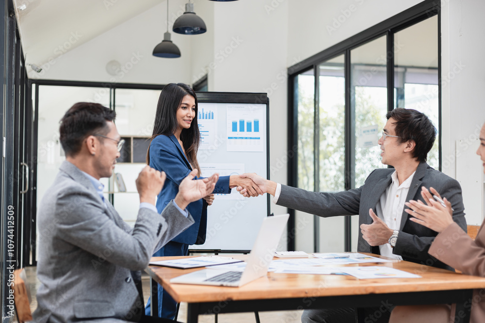 Asian business teamwork working with analysis report and advisor showing plan, Financial analysis and Marketing teamwork concept. Asian business teamwork working with analysis report and advisor showing plan, Financial analysis and Marketing teamwork concept.