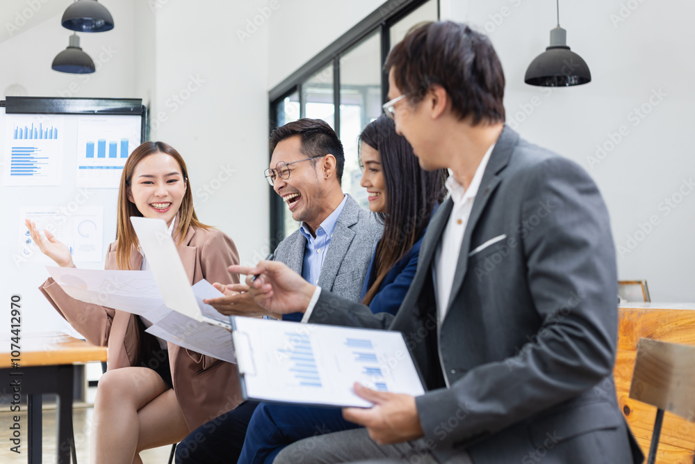 Asian business teamwork working with analysis report and advisor showing plan, Financial analysis and Marketing teamwork concept. Asian business teamwork working with analysis report and advisor showing plan, Financial analysis and Marketing teamwork concept.