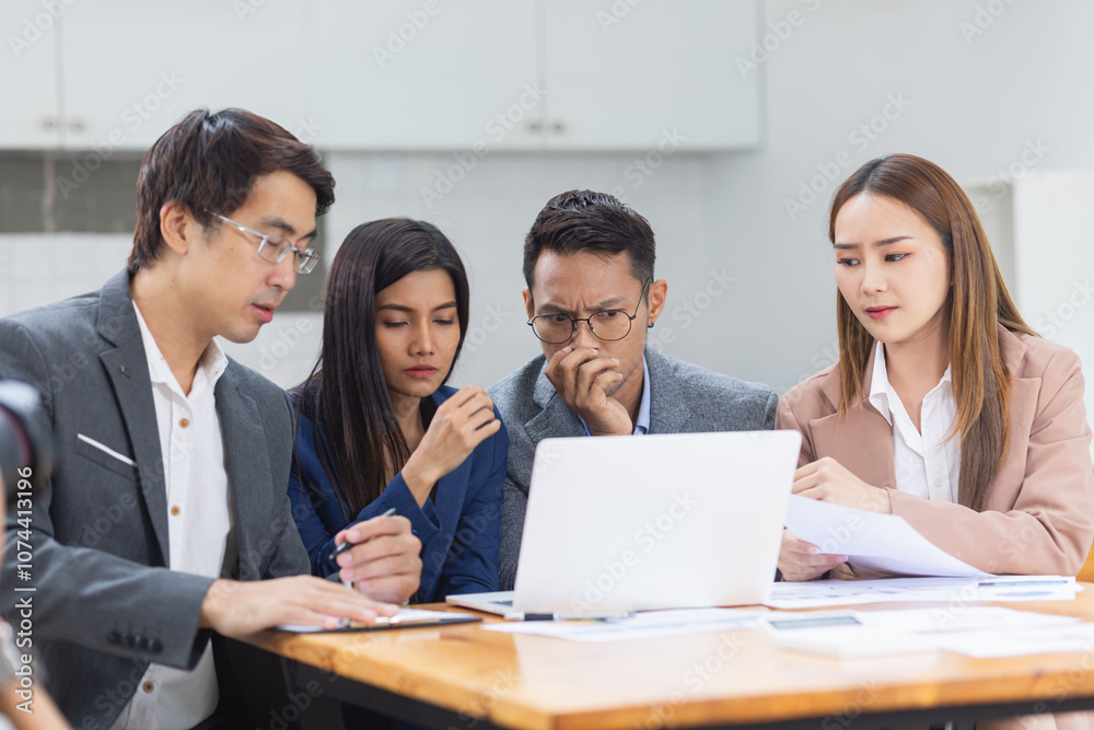 Asian business teamwork working with analysis report and advisor showing plan, Financial analysis and Marketing teamwork concept. Asian business teamwork working with analysis report and advisor showing plan, Financial analysis and Marketing teamwork concept.