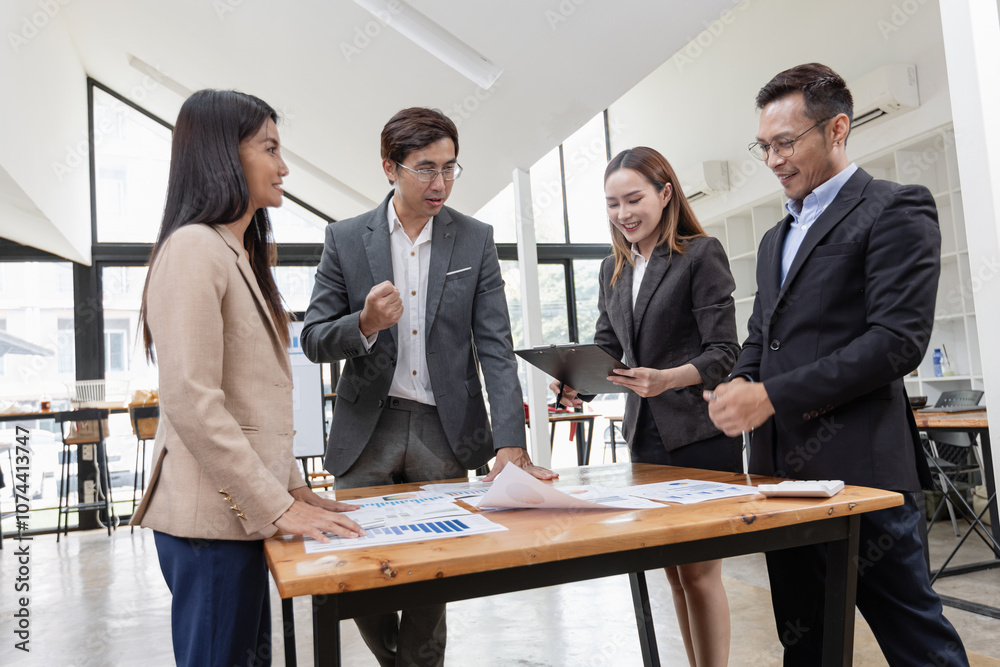 Asian business teamwork working with analysis report and advisor showing plan, Financial analysis and Marketing teamwork concept. Asian business teamwork working with analysis report and advisor showing plan, Financial analysis and Marketing teamwork concept.