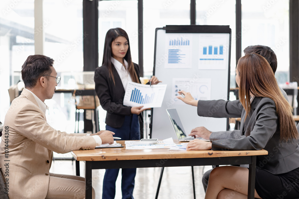Fototapeta premium Asian business teamwork working with analysis report and advisor showing plan, Financial analysis and Marketing teamwork concept.
