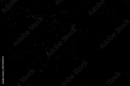 Chaotic white star bokeh on black background. falling blurry bokeh snow overlay, starry sky. white spot and drops. abstraction