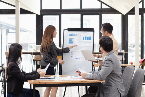 Asian business teamwork working with analysis report and advisor showing plan, Financial analysis and Marketing teamwork concept.