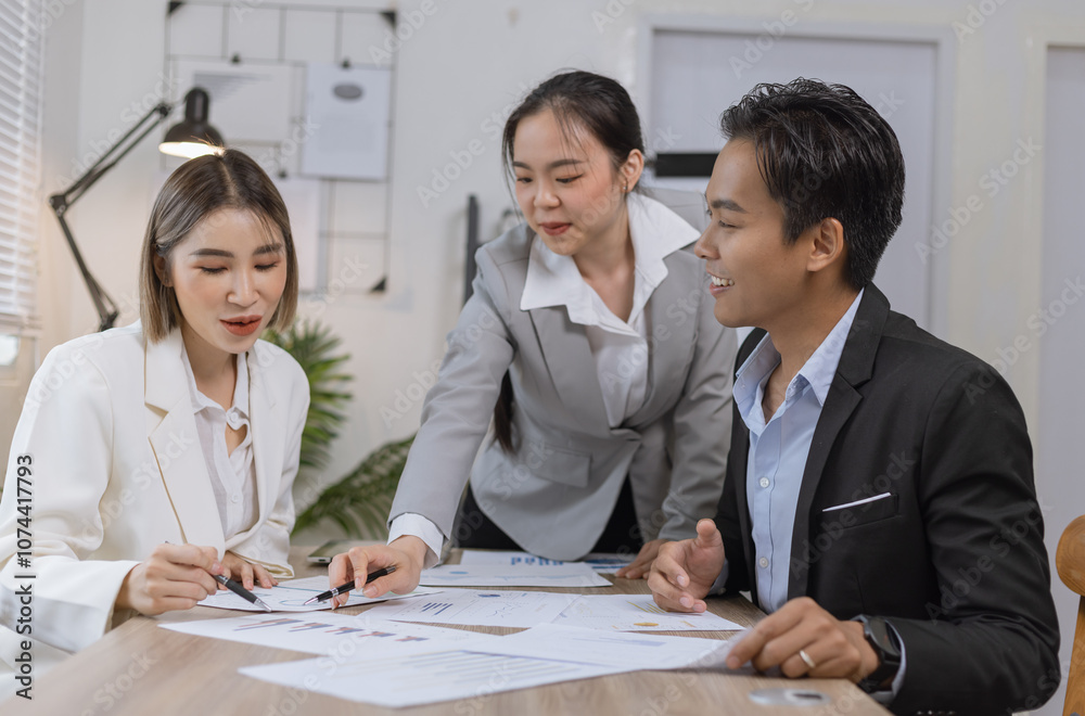 Asian business teamwork working on digital tablet with analysis report and advisor showing plan, Financial analysis and Marketing teamwork concept.