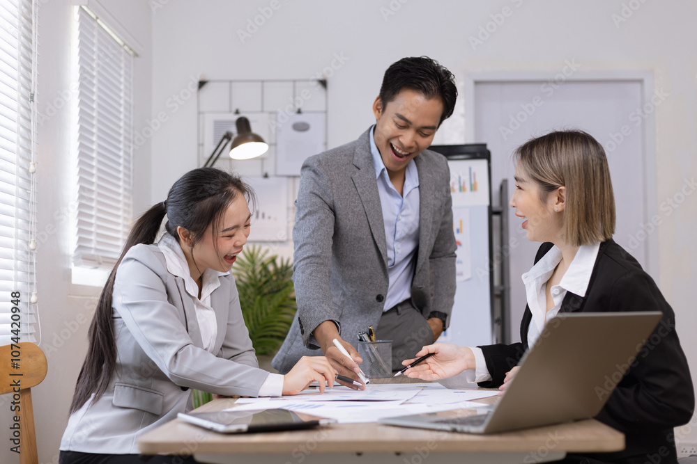 Asian business teamwork working on digital tablet with analysis report and advisor showing plan, Financial analysis and Marketing teamwork concept. Asian business teamwork working on digital tablet with analysis report and advisor showing plan, Financial analysis and Marketing teamwork concept.