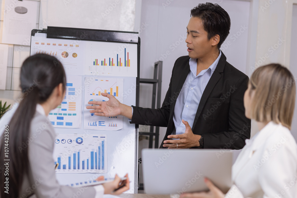Asian business teamwork working on digital tablet with analysis report and advisor showing plan, Financial analysis and Marketing teamwork concept. Asian business teamwork working on digital tablet with analysis report and advisor showing plan, Financial analysis and Marketing teamwork concept.