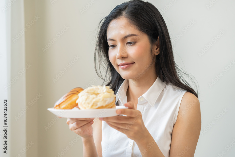 Portrait of happy smile asian young woman, girl temptation food, holding donut plate, enjoy eating sugar glazed doughnut delicious dessert sweet, snack tasty. Eat fast food, junk food meal getting fat Portrait of happy smile asian young woman, girl temptation food, holding donut plate, enjoy eating sugar glazed doughnut delicious dessert sweet, snack tasty. Eat fast food, junk food meal getting fat