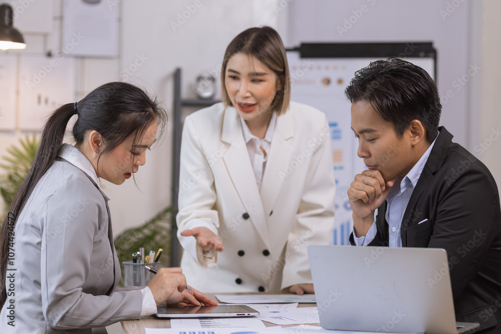 Asian business teamwork working on digital tablet with analysis report and advisor showing plan, Financial analysis and Marketing teamwork concept. Asian business teamwork working on digital tablet with analysis report and advisor showing plan, Financial analysis and Marketing teamwork concept.