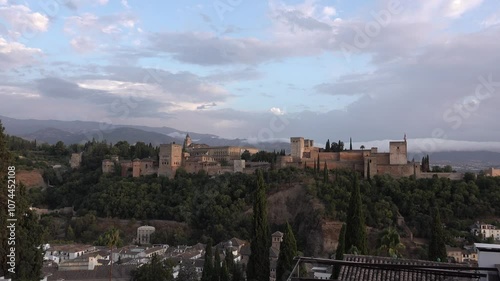 Alhambra Castle in Granada at sunset from San Nicolas viewpoint, Andalucia, Spain. High quality 4k footage