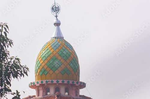 view of the mosque dome with a white sky background