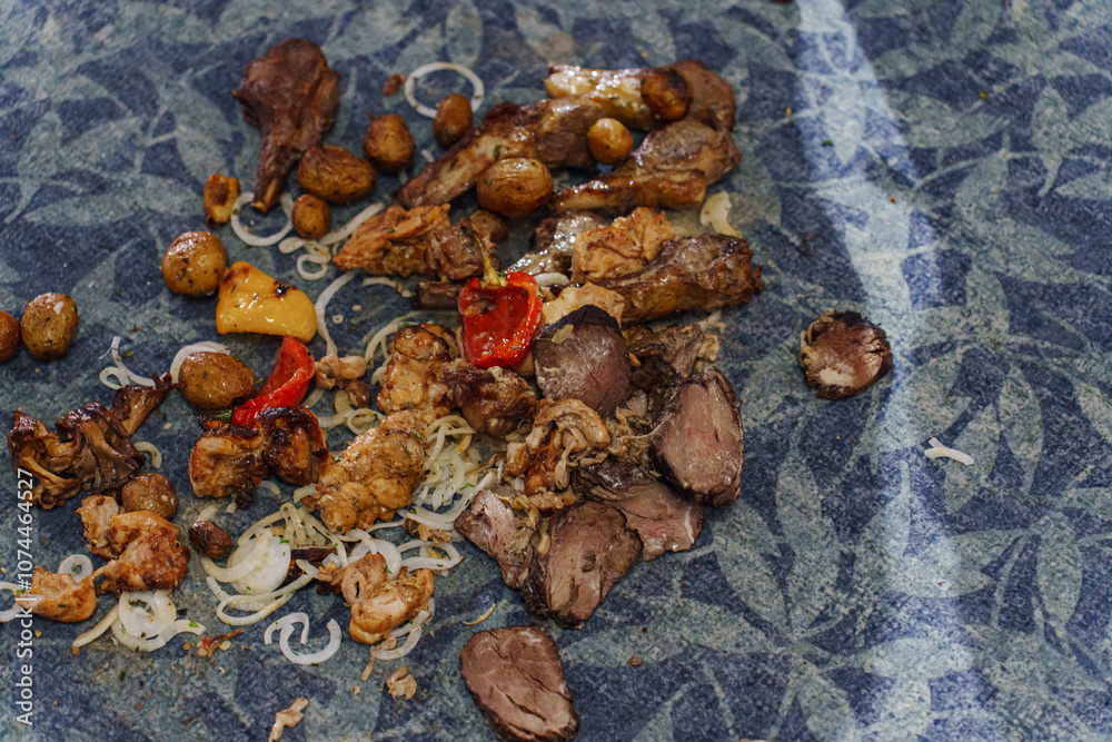 Food on the floor. Meat and vegetables fell on the carpet in the restaurant. Food on the floor. Meat and vegetables fell on the carpet in the restaurant.