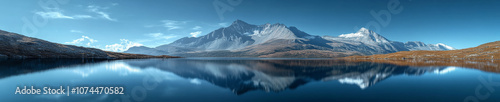 Majestic panoramic landscape of mountain range reflecting in serene lake, showcasing stunning natural beauty and tranquility