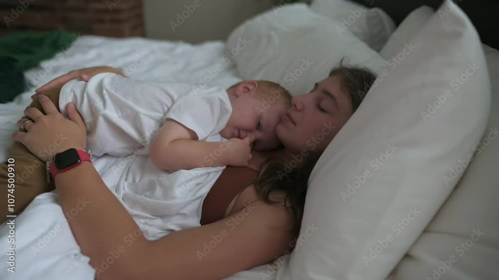 mother and her child cuddle closely while sleeping on bed, capturing serene moment of love, trust, and comfort in cozy bedroom environment. mother and her child cuddle closely on bed love trust mother and her child cuddle closely while sleeping on bed, capturing serene moment of love, trust, and comfort in cozy bedroom environment. mother and her child cuddle closely on bed love trust