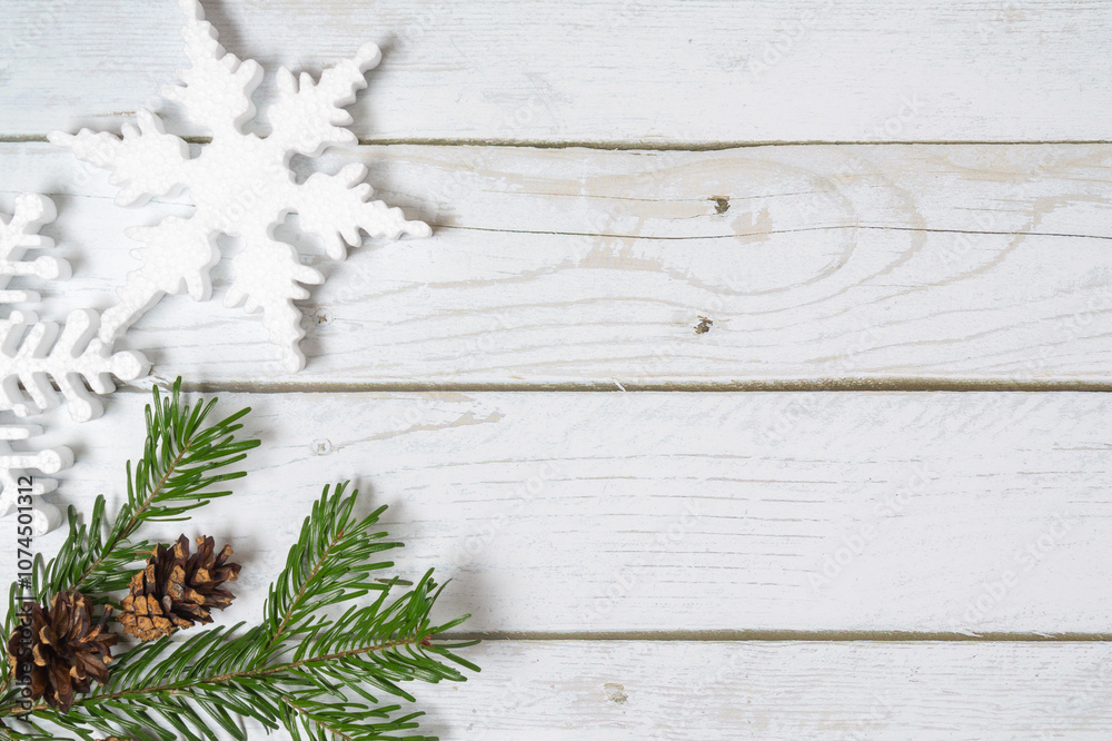 Christmas decorations on a wooden background: Christmas tree balls, branches, snowflakes and candy canes, top view, copyspace Christmas decorations on a wooden background: Christmas tree balls, branches, snowflakes and candy canes, top view, copyspace