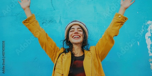 A woman stands with her arms raised, expression unknown