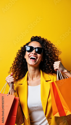 Joyful Woman with Shopping Bags on Yellow Background: Perfect for Retail Ads or Fashion Promotions