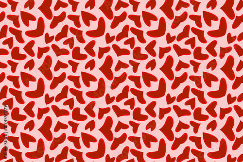 A playful pattern of red hearts on a soft pink background showcasing love and warmth