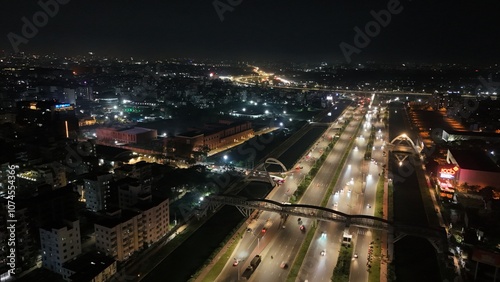 Beautiful aerial drone sky shot of night city view of the road stress, Night Scenery, Flyover, and River, which is located in Dhaka Bangladesh