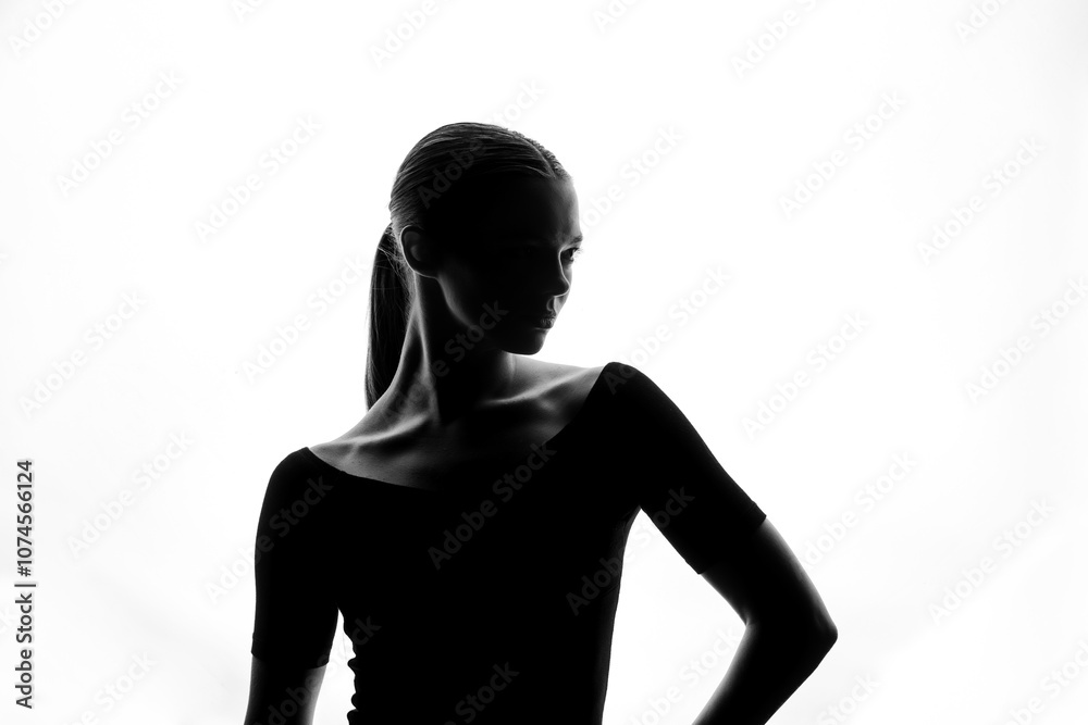 Fototapeta premium Graceful Silhouette of Woman in Elegant Side Profile