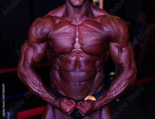 bodybuilder body part details. bodybuilder in competition, detail.