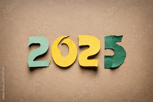 Wallpaper Mural Torn paper numbers forming 2025 on brown background Torontodigital.ca