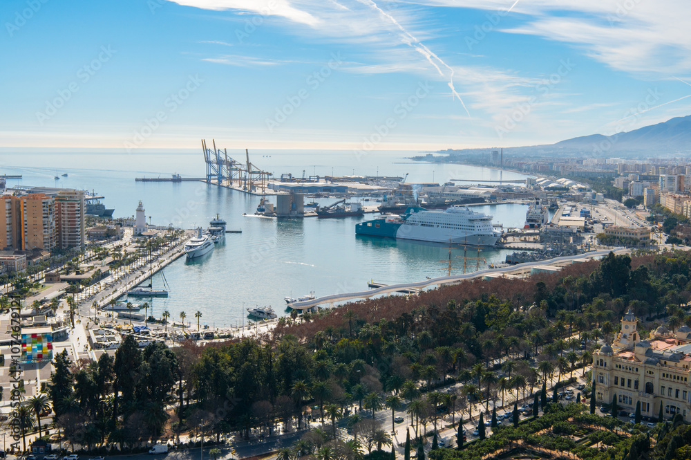 Naklejka premium Malaga city and port, Andalucia, Costa del sol, Spain. Cruise ship, cranes, lighthouse. Málaga bay and harbour