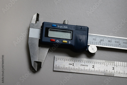 Digital Caliper and Stainless steel ruler for quality assurance, engineering design, mechanical design tools. Ruler with imperial markings.