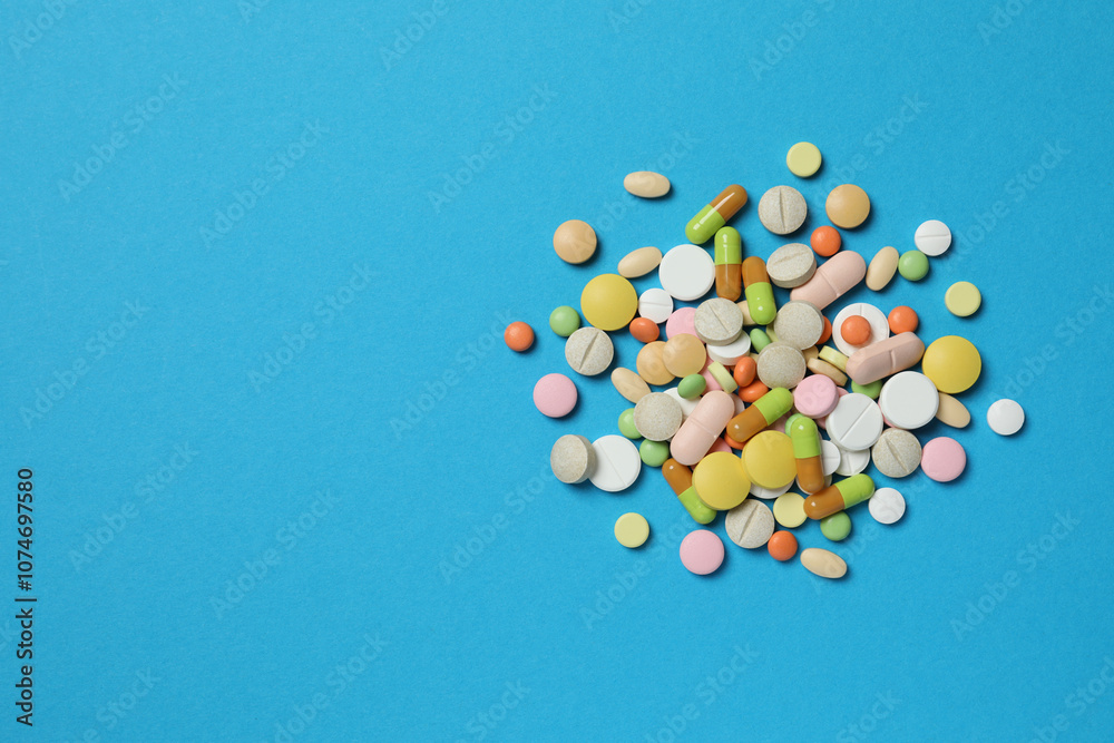 Various medicine pills on color background 