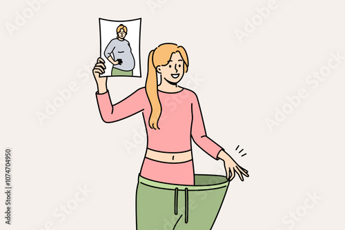 Lost weight woman in huge pants, showing own old photo with big belly and fat or cellulite on hips. Lost weight girl is proud of transformation achieved thanks to low-carb diet and regular fitness
