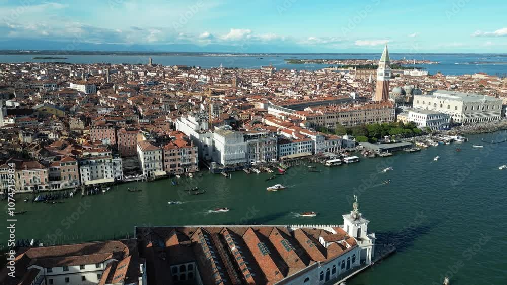 Venice waterfront featuring St. Mark’s Campanile and the Grand Canal. Wide-angle aerial view. Venice waterfront featuring St. Mark’s Campanile and the Grand Canal. Wide-angle aerial view.