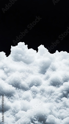 A stunning and intricate snow pile glowing against a stark black backdrop features sharp details and depth on a winter's day