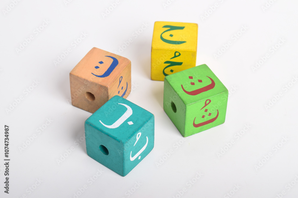 Wooden Arabic Alphabet Blocks isolated on white background. Kindergarten education concept Wooden Arabic Alphabet Blocks isolated on white background. Kindergarten education concept