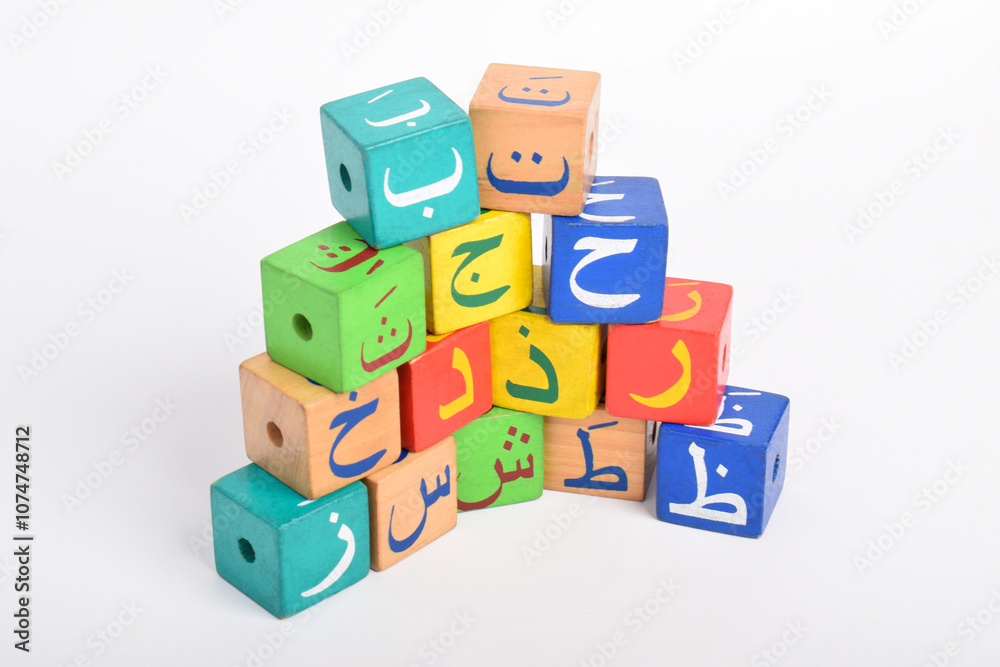 Wooden Arabic Alphabet Blocks isolated on white background. Kindergarten education concept Wooden Arabic Alphabet Blocks isolated on white background. Kindergarten education concept