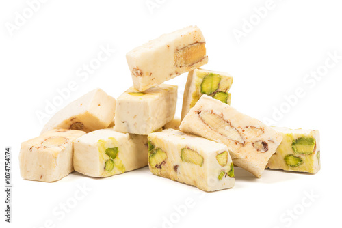 Italian torrone nougat candy blocks with almonds and pistachios isolated