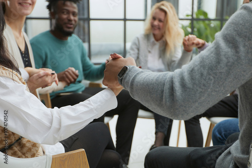 close-up of a business team sitting holding hands