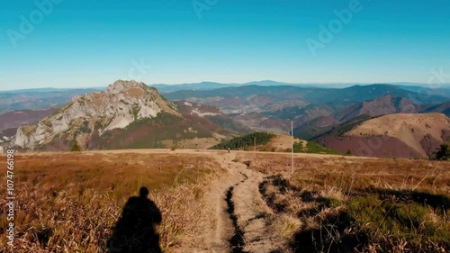 Timelapse, walking along the mountain ridge in the national park. Idyllic Carpathian nature in autumn on a sunny day photo