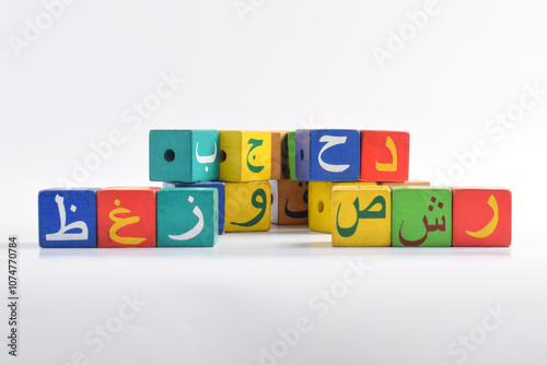 Wooden Arabic Alphabet Blocks isolated on white background. Arabic Alphabet Cubes. Preschool and education concept. Copy space