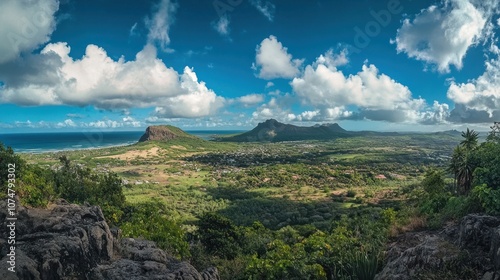 Panoramic View of a Lush Tropical Landscape with Mountains and Ocean in the Background