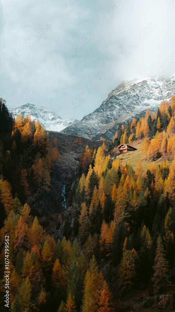 Stunning mountain scenery in fall with old farmhouse at sunrise, Osttirol region, Tyrol, Austria
